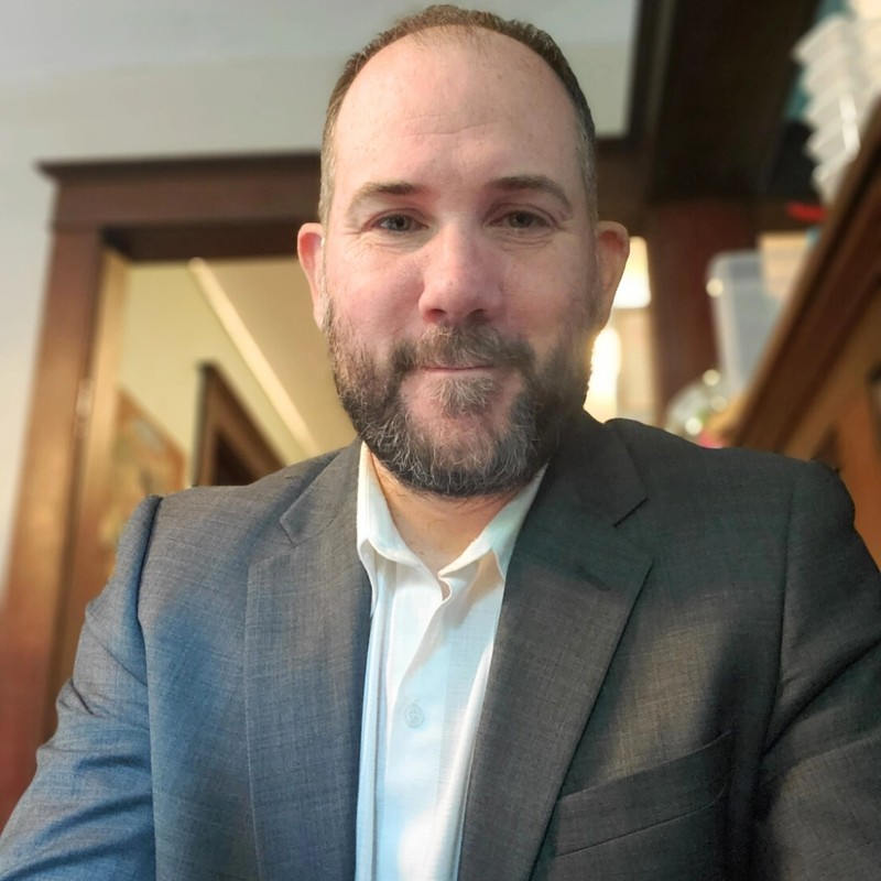 David McDonald in a suit, criminal defense attorney